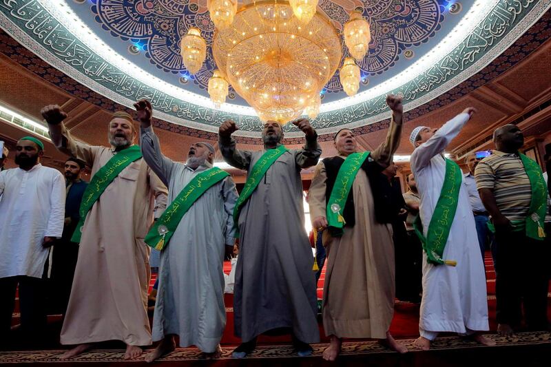 Worshippers utter religious chants at the Abdul Qadir Gilani Mosque in Baghdad, Iraq. AFP