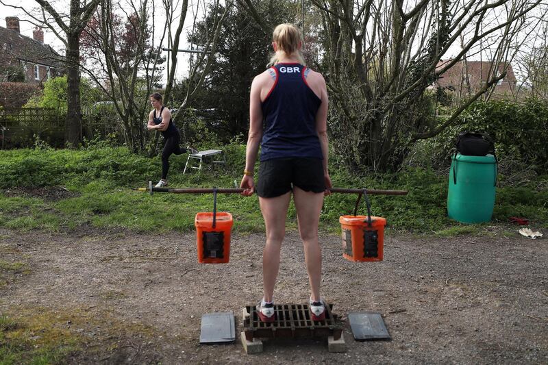 GLOUCESTER, ENGLAND - APRIL 07: Rowers Melissa Wilson (left) and Holly Hill (right) of the Great Britain Rowing Team train in a forest near their house by doing a homemade circuits session as they train in Isolation on April 07, 2020 in Gloucester, England.  The coronavirus and the disease it causes, COVID-19, are having a fundamental impact on society, government, sports and the economy in United Kingdom. As all sports events in United Kingdom have been cancelled athletes struggle to continue their training as usual. (Photo by Naomi Baker/Getty Images)
