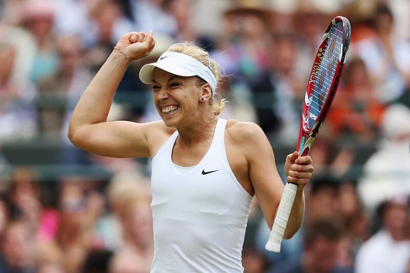 Sabine Lisicki of Germany celebrates after winning her singles match against Ana Ivanovic at the 2014 Wimbledon Championships on Monday. Matthew Stockman / Getty Images