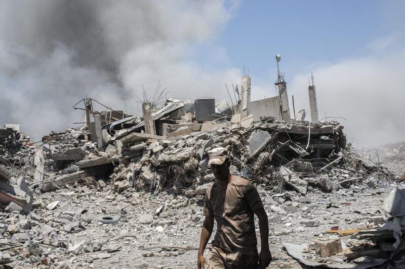 An Iraqi Army soldier walks past a destroyed building after an Iraqi forces airstrike targeted an Islamic State sniper position in Al Shifa, the last district of west Mosul, under Islamic State control. Martyn Aim / Getty Images