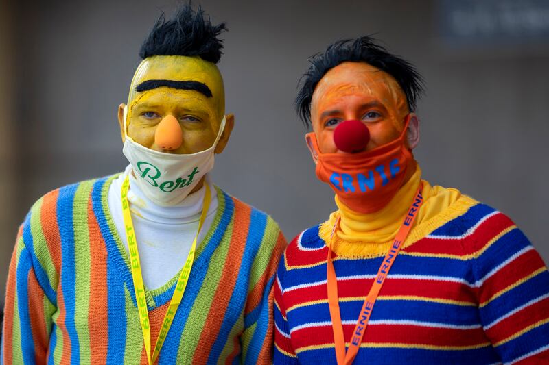 Cosplayers dressed as Bert and Ernie from 'Sesame Street' pose during New York Comic Con. Charles Sykes / Invision / AP