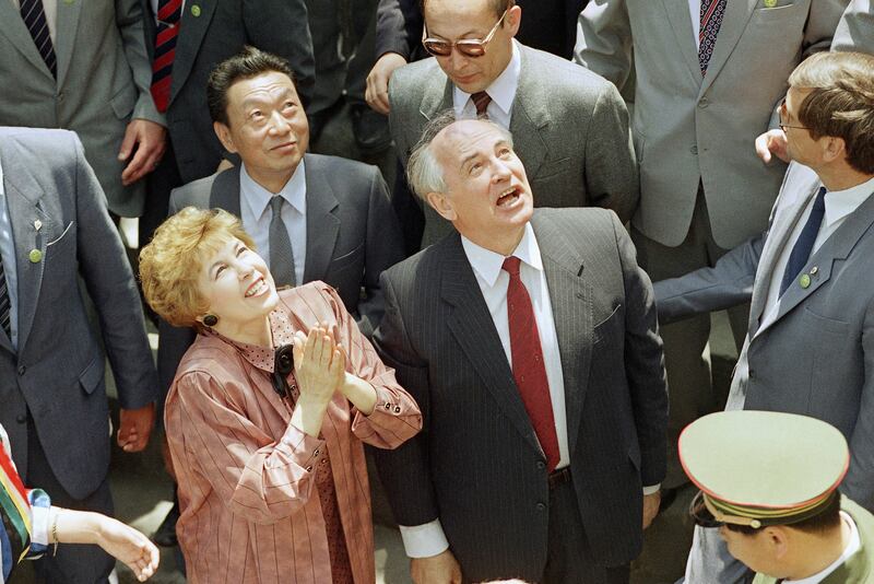 Gorbachev and his wife Raisa take  in the view during a tour of China's Great Wall, in Beijing, in May 1989. AP