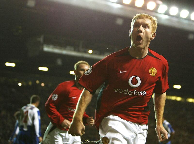 MANCHESTER, ENGLAND - MARCH 9:  Paul Scholes of Manchester United celebrates scoring the opening goal during the UEFA Champions League match between Manchester United and FC Porto at Old Trafford on March 9, 2004 in Manchester, England.  (Photo by Laurence Griffiths/Getty Images)