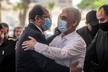 Hamas chief Yahya Sinwar, right, meets Egyptian intelligence head Abbas Kamel in Gaza on May 31. EPA