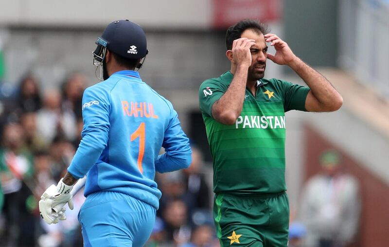 Pakistan's Wahab Riaz, right, reacts after India's K.L. Rahul, left, played a shot on his delivery during the Cricket World Cup match between India and Pakistan at Old Trafford in Manchester, England, Sunday, June 16, 2019. (AP Photo/Aijaz Rahi)