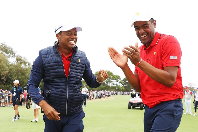 Woods  and Tony Finau of the United States team celebrate the victory. Getty