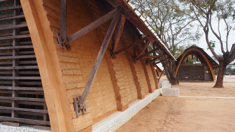 A grid of classroom pods are centred around pre-existing foliage. Photo: Amir Anoushfar / Aga Khan Trust for Culture