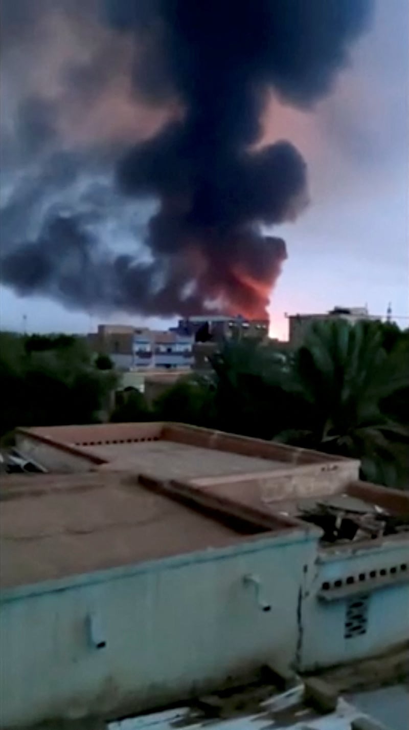 Smoke from a fire near a military complex containing an arms factory in southern Khartoum, Sudan. Reuters