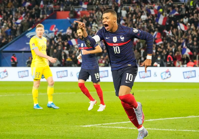 Mbappe celebrates after the second. AP