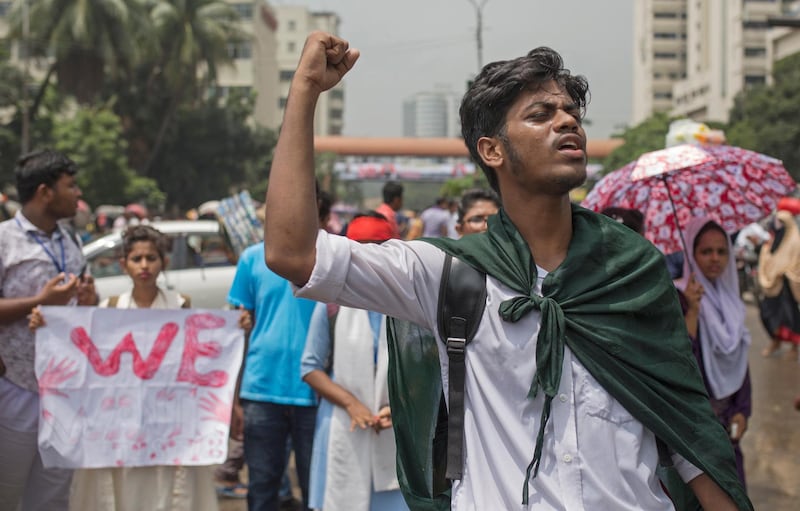 Bangladeshi student shout slogans to join their 'Safe roads movement' during a rally demanding safe roads on the seventh consecutive day of protests, in Dhaka city, Bangladesh.  EPA / MONIRUL ALAM