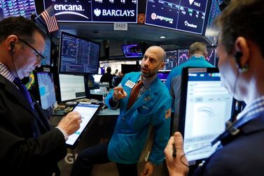 Traders on the floor of the New York Stock Exchange on Wall Street last week. Fourth quarter earnings are predicted to be marginally lower year-on-year when earnings season begins this week. AP Photo