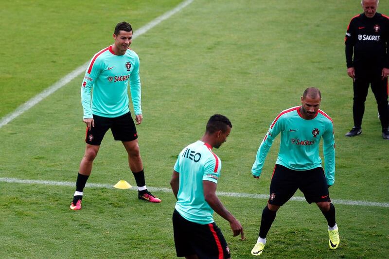 Portugal's Christiano Ronaldo, left, Nani, center, and Ricardo Quaresma, exercise with the ball. (AP Photo/Thibault Camus)
