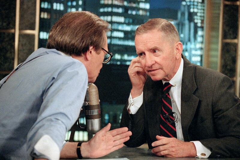 Texas billionaire Ross Perot talks to Larry King during a commercial break in the live broadcast of CNN's Larry King Live on July 18, 1992. AP Photo