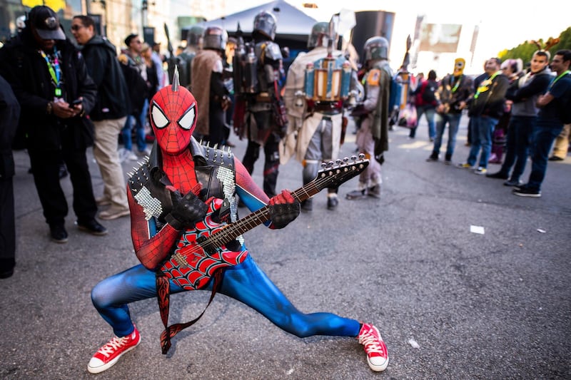 An attendee dressed as a punk rock Spider-Man poses during New York Comic Con.  AP