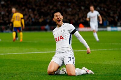 TOPSHOT - Tottenham Hotspur's South Korean striker Son Heung-Min celebrates scoring the opening goal during the UEFA Champions League round of sixteen second leg football match between Tottenham Hotspur and Juventus at Wembley Stadium in London, on March 7, 2018. / AFP PHOTO / IKIMAGES / Ian KINGTON