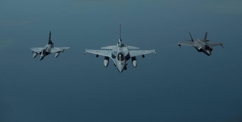 A UAE Air Force Mirage 2000 (left), UAE F-16 Desert Falcon (centre) and a US F-35A Lightning II (right) fly a partnering flight in the US Central Command area of responsibility, in the Arabian Gulf. Reuters
