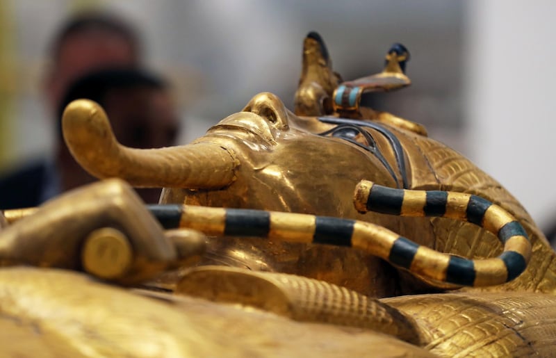 The mask of ancient Egypt's boy-king Tutankhamun is seen on the lid of his coffin as it undergoes restoration at the Grand Egyptian Museum in Giza, Egypt September 21, 2019. REUTERS/Mohamed Abd El Ghany
