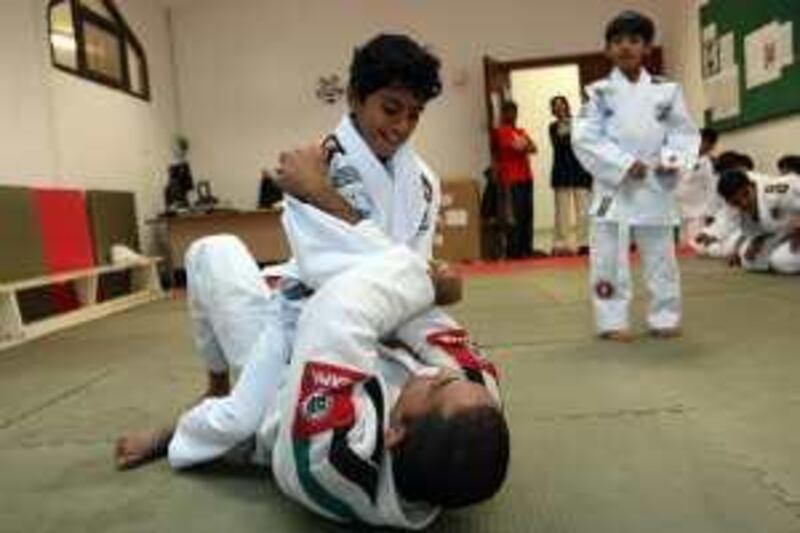 ABU DHABI. 4th Feb 2009. Rashed Daood (12) practices a hold on  instructor Marcelo Freitas during a Jiu-Jitsu class at the Zayed al Thani school in Abu Dhabi. Stephen Lock  /  The National  . FOR SATURDAY PAPER. *** Local Caption ***  SL-jitsu-002.jpgSL-jitsu-002.jpg