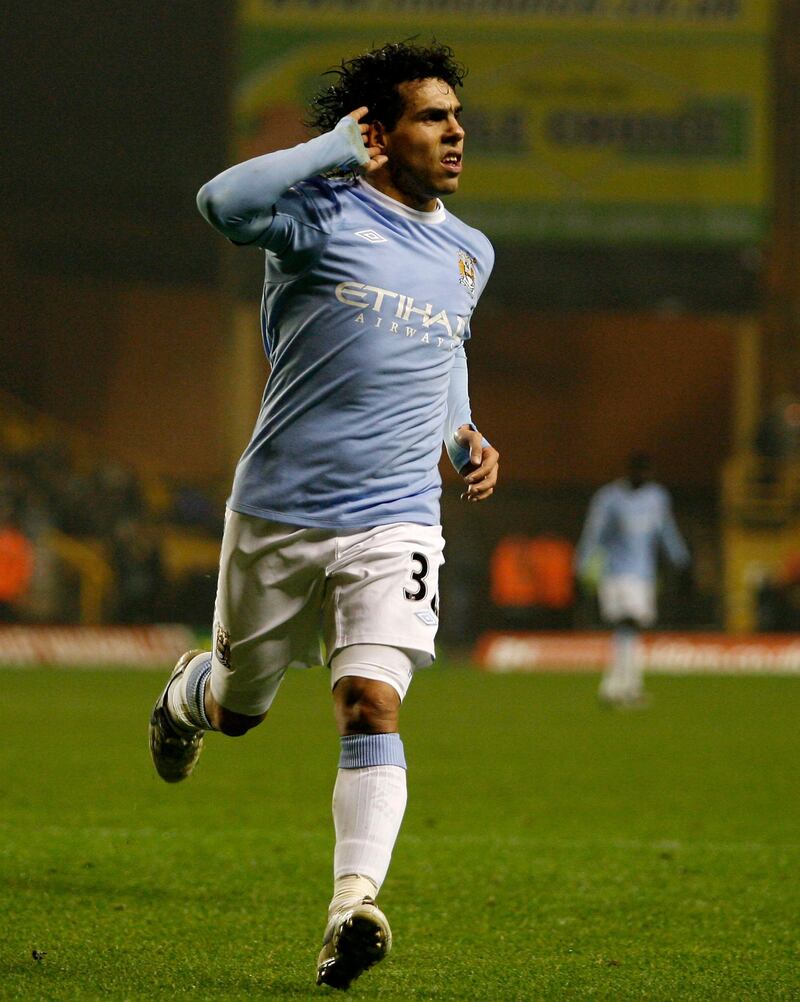 Manchester City's Argentinian player Carlos Tevez celebrates scoring his second goal against Wolverhampton Wanderers during a Premier League match at Molineux Stadium in Wolverhampton, West Midlands, England on December 28, 2009. AFP PHOTO/IAN KINGTON

FOR EDITORIAL USE ONLY Additional licence required for any commercial/promotional use or use on TV or internet (except identical online version of newspaper) of Premier League/Football League photos. Tel DataCo +44 207 2981656. Do not alter/modify photo. (Photo by IAN KINGTON / AFP)