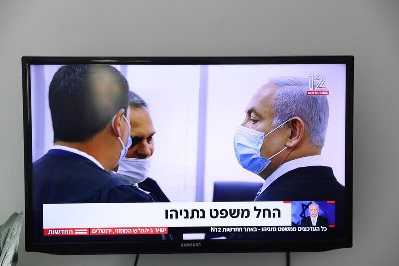 A live TV broadcast shows Israeli Prime Minister Benjamin Netanyahu and his lawyers entering the district court where he is facing a trial for alleged corruption crimes in Salah el-Din, East Jerusalem, Israel.  EPA