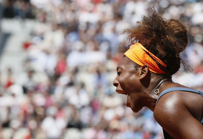 TOPSHOTSUSA's Serena Williams celebrates after winning a point against to Russia's Svetlana Kuznetsova during their French Tennis Open quarter final match at the Roland Garros stadium in Paris, on June 4,  2013. AFP PHOTO / PATRICK KOVARIK
 *** Local Caption ***  267767-01-08.jpg