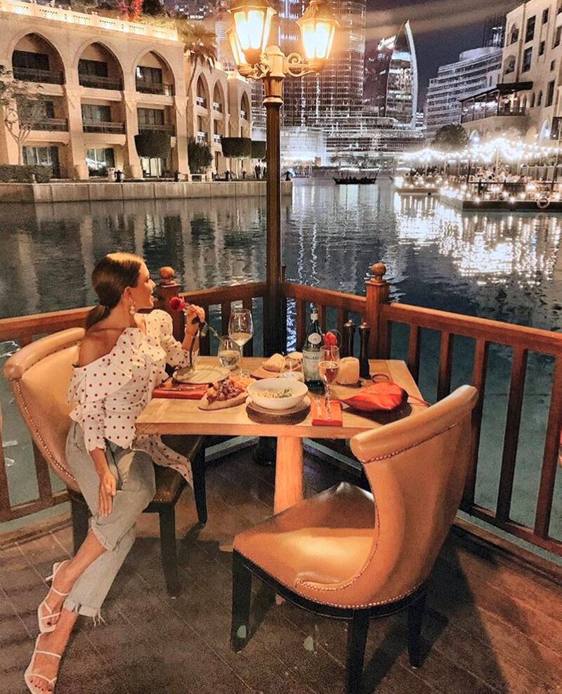 "Journalist, PR & fashion blogger" Paula Ordovas had the "dinner of [her] dreams with best views of Dubai & live music at Asado" on February 14. Twitter /  Paula Ordovas
