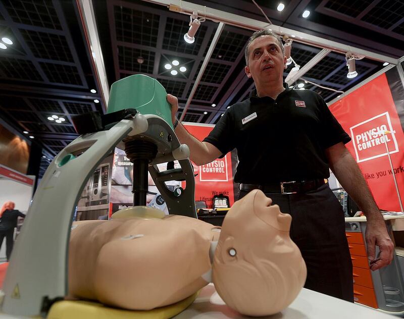Sami Jabbour, regional business manager of Physio Control, demonstrates the Lucas cardiopulmonary resuscitation machine at the Dihad exhibition at the World Trade Centre in Dubai. Satish Kumar / The National 