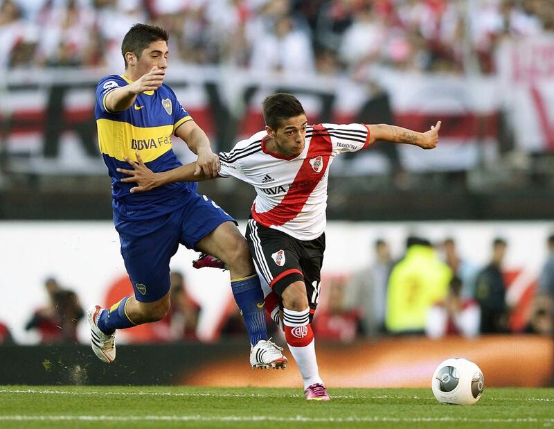 Midfielder Manuel Lanzini, right, will be the youngest foreign player to ever join the Arabian Gulf League when he dressses for Al Jazira. Juan Mabromata / AFP