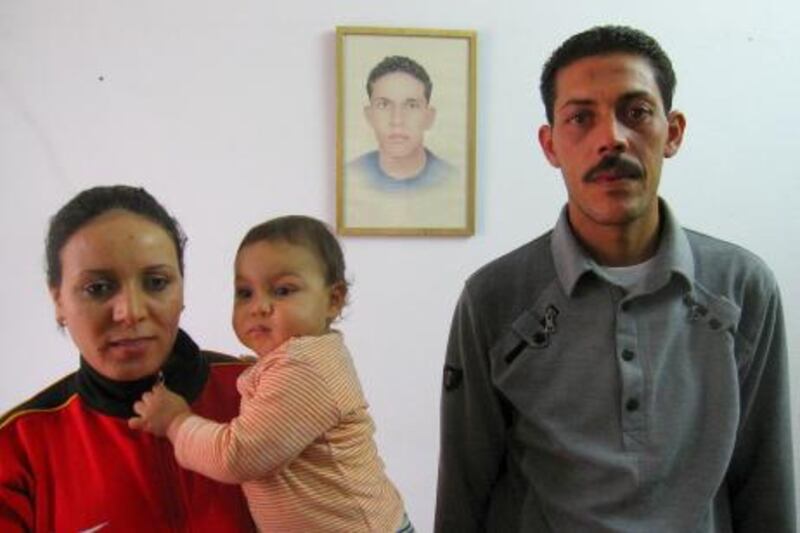Salem Bouazizi with his wife, Salma Ameri and their son, Omar, in the family's house in Sfax, Tunisia. On the wall is a portrait of Salem's late brother, Mohamed Bouazizi.

Credit: John Thorne/The National