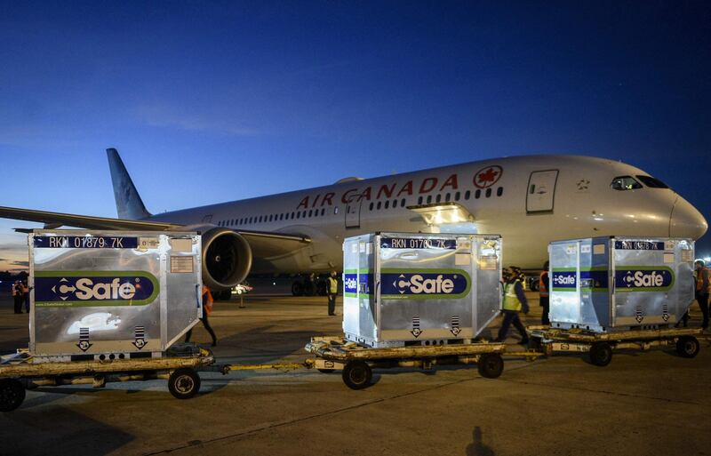 Handout photo released by Argentina's Presidency showing shipping containers with some 2.148.600 Oxford/AstraZeneca COVID-19 vaccines upon their arrival from the US, at the Ezeiza International airport in Buenos Aires province, Argentina, on May 31, 2021. RESTRICTED TO EDITORIAL USE - MANDATORY CREDIT "AFP PHOTO / ARGENTINA'S PRESIDENCY / Maria Eugenia CERUTTI " - NO MARKETING - NO ADVERTISING CAMPAIGNS - DISTRIBUTED AS A SERVICE TO CLIENTS
 / AFP / Argentinian Presidency / MARIA EUGENIA CERUTTI / RESTRICTED TO EDITORIAL USE - MANDATORY CREDIT "AFP PHOTO / ARGENTINA'S PRESIDENCY / Maria Eugenia CERUTTI " - NO MARKETING - NO ADVERTISING CAMPAIGNS - DISTRIBUTED AS A SERVICE TO CLIENTS
