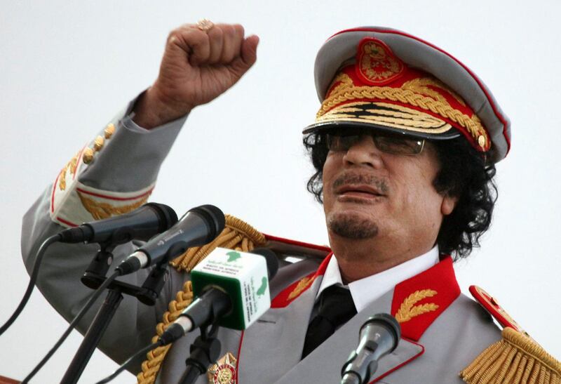 FILE - In this Saturday, June 12, 2010 file photo, Libyan leader Moammar Gadhafi talks during a ceremony to mark the 40th anniversary of the evacuation of the American military bases in the country, in Tripoli, Libya. The Associated Press is aware of reports that Moammar Gadhafi has been captured in Sirte. The chief spokesman for the revolutionary National Transitional Council Jalal el-Gallal and the council military spokesman Abdul-Rahman Busin told the AP that those reports are unconfirmed. (AP Photo/ Abdel Magid Al Fergany, File) *** Local Caption ***  Mideast Libya.JPEG-0a069.jpg