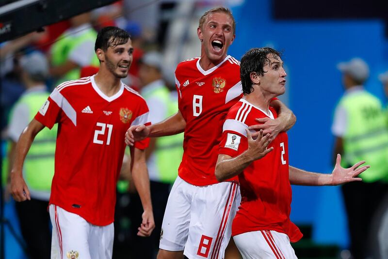 Russia's Mario Fernandes celebrates with his teammates after scoring his side's second goal. Manu Fernandez/AP Photo