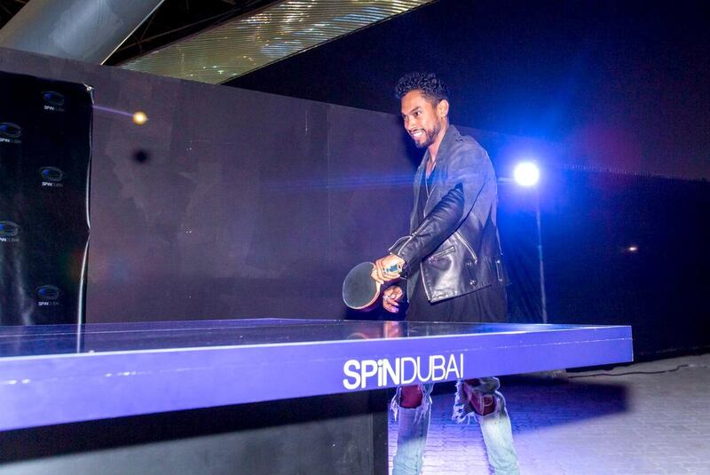 Singer Miguel plays ping pong. Courtesy Lumin