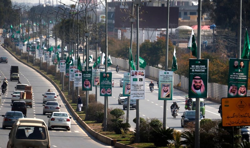 Posters welcoming Mohammad Bin Salman hang from lamp poles in Islamabad. EPA