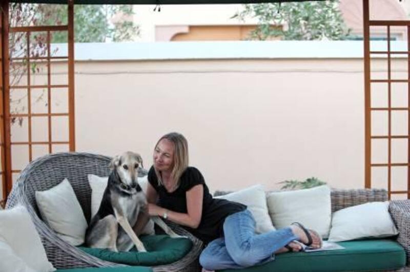Rebecca Rees and her two-year-old Saluki mix, Sam, hang out in their spacious new home in Jumeirah Village. "After 10 months in an apartment with Sam, I just thought he deserved more space," Rees says. Amy Leang / The National