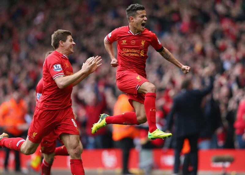Philippe Coutinho of Liverpool celebrates scoring his team's third goal during the Premier League match between Liverpool and Manchester City at Anfield on April 13, 2014 in Liverpool, England. Alex Livesey/Getty Images

