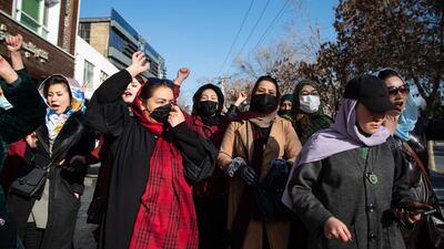 Afghan women protest against a new Taliban ban on women accessing University Education on December 22, in Kabul. Getty Images