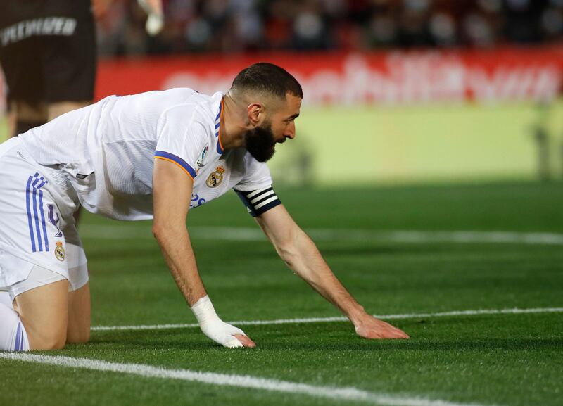 Real Madrid's French forward Karim Benzema reacts during the Spanish League football match between RCD Mallorca and Real Madrid CF at the Son Moix stadium in Palma de Mallorca on March 14, 2022.  (Photo by JAIME REINA  /  AFP)