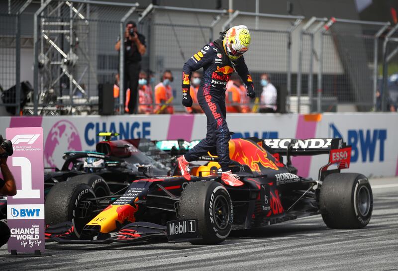 Red Bull's Max Verstappen celebrates winning the race.