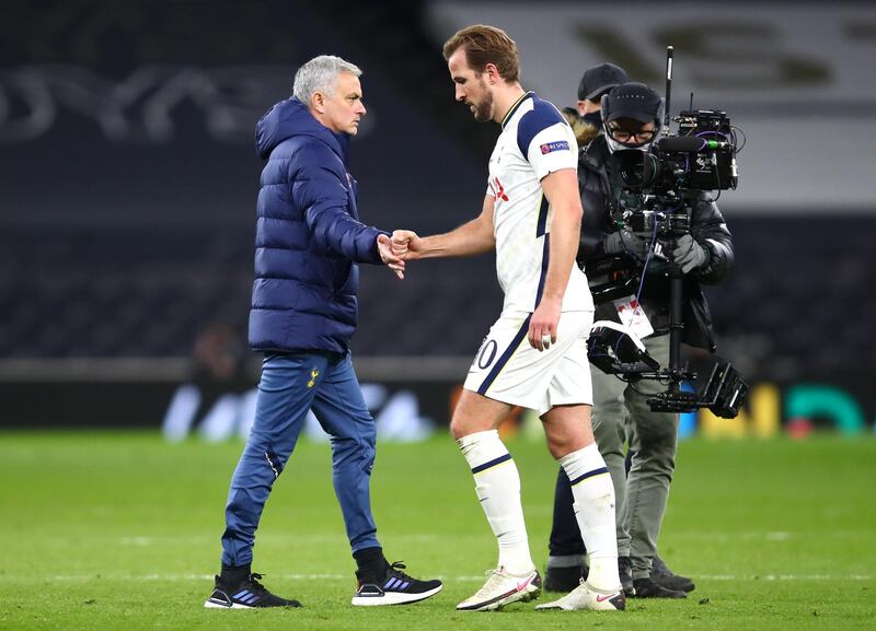 Spurs manager Jose Mourinho, Manager shakes hands with Harry Kane after the match. Getty