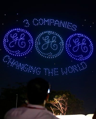 Drones light up the sky creating various formations of GE company logos over the John F Welch Technology Centre (JFWTC) in Bengaluru, India, on Tuesday. EPA