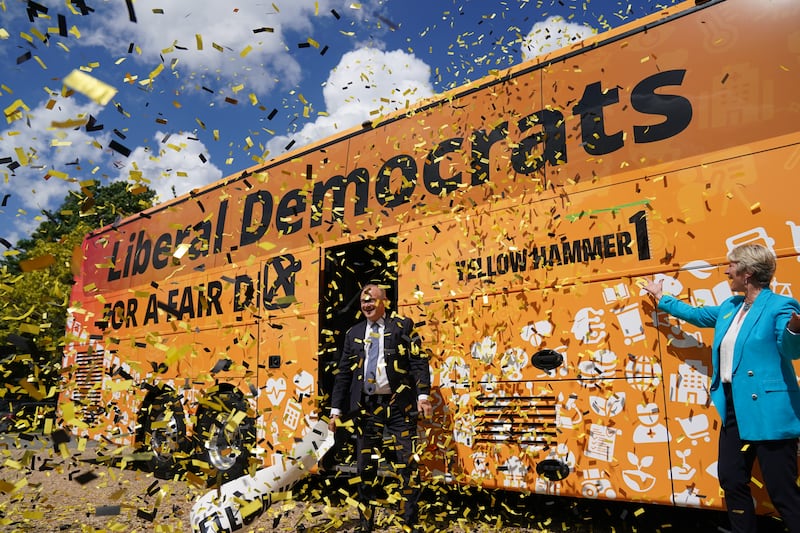 Mr Davey launches his party's general election campaign battle bus in Cambridge. PA