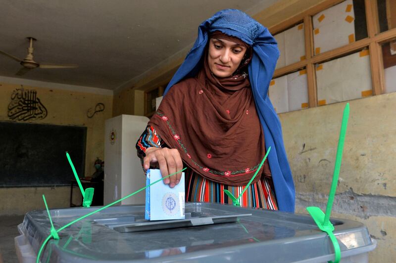 TOPSHOT - A woman casts her vote at a polling station in Jalalabad on September 28, 2019.  Insurgents worked to disrupt Afghanistan's presidential election on September 28, with a series of blasts reported across the country as voters headed to the polls and troops flooded the streets of the capital. / AFP /  Noorullah SHIRZADA                            
