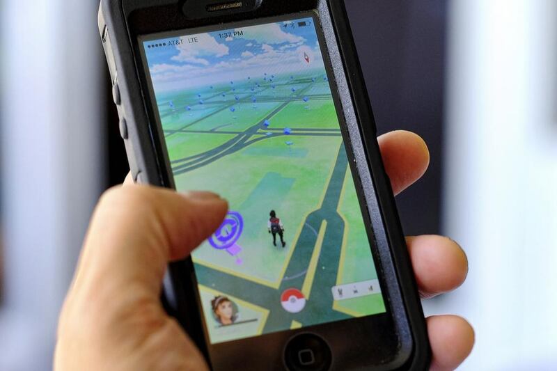 Pokemon Go is displayed on a cell phone in Los Angeles on Friday, July 8, 2016. Just days after being made available in the US, the mobile game Pokemon Go jumped to become the top-grossing app in the App Store. Richard Vogel / AP Photo