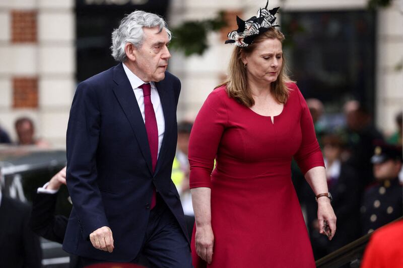Former British prime minister Gordon Brown and his wife Sarah arrive for the service. AFP
