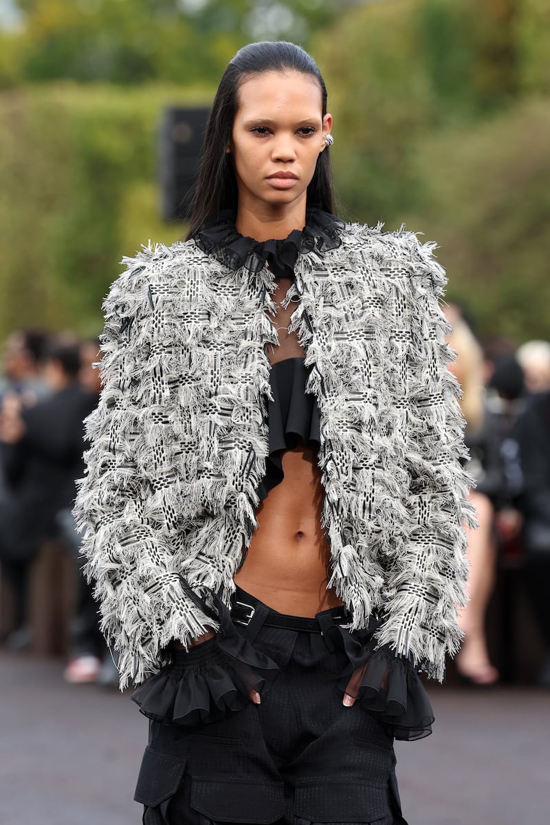 A shaggy tweed jacket with combat trousers at Givenchy womenswear spring/summer 2023. Getty 