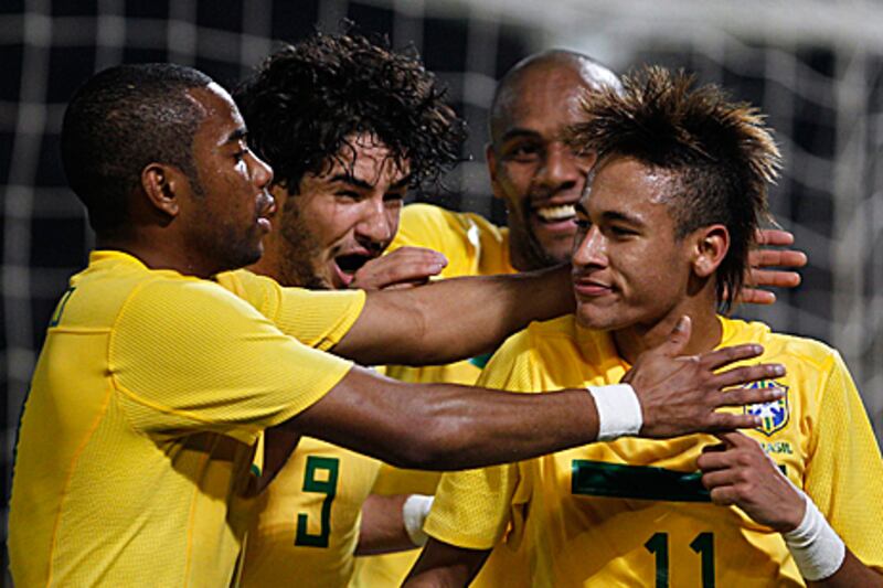 Neymar, right, is congratulated by Brazilian teammates, from left, Robinho, Alexandre Pato and Maicon after scoring against Ecuador in their final Copa America Group C match.