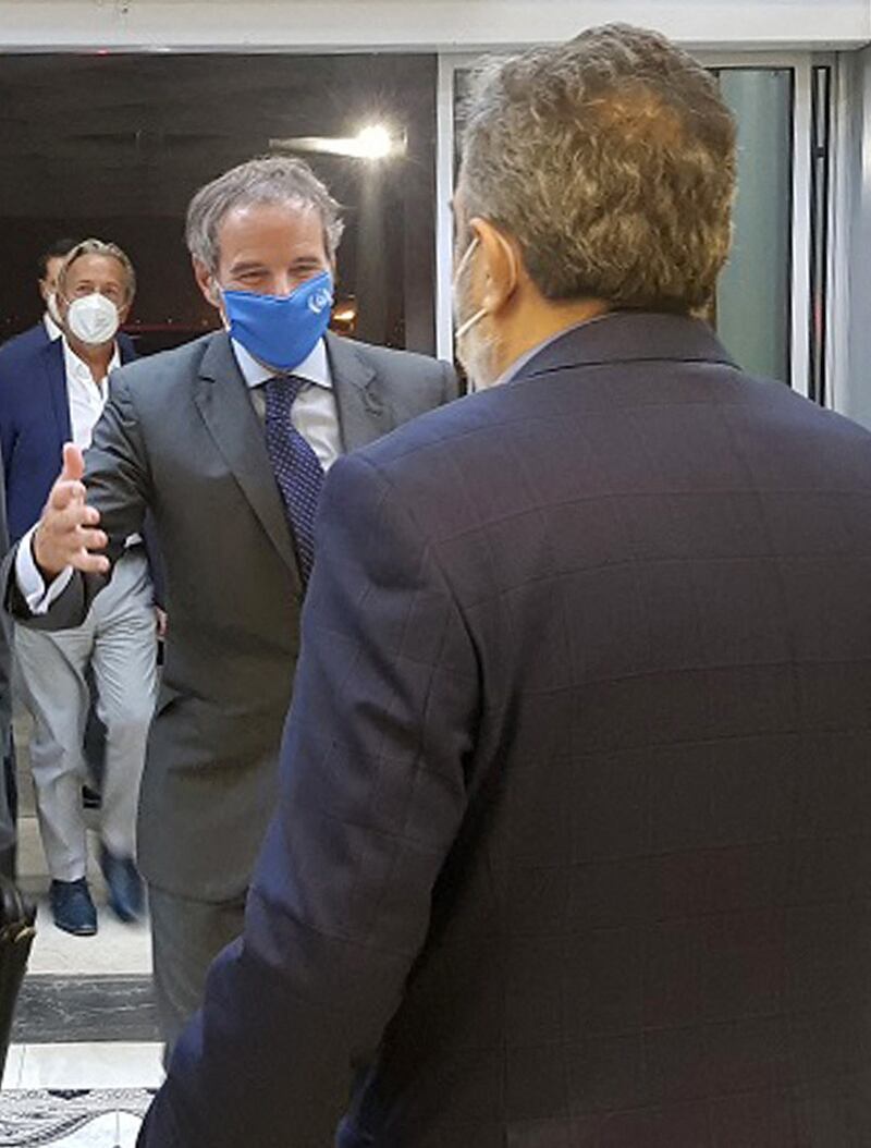 IAEA chief Rafael Grossi, second right, is welcomed by the deputy head of Iran's Atomic Energy Organisation, Behrouz Kamalvandi, upon his arrival in Tehran. AFP