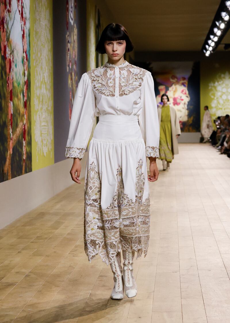 Floral motifs were rendered in lace and embroidery.