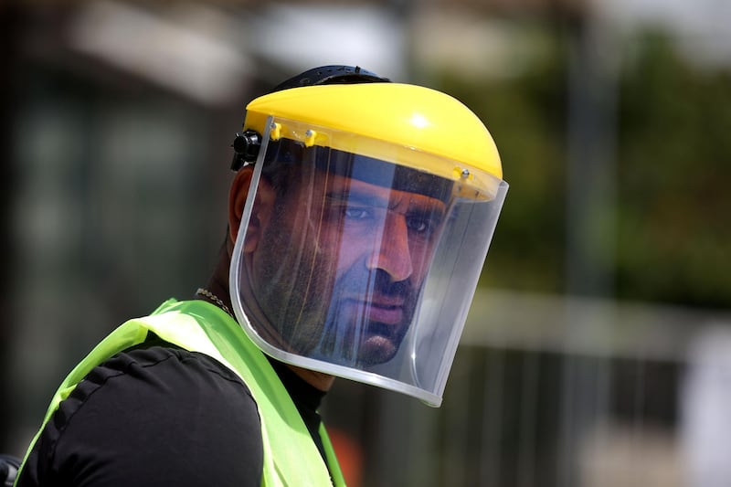 A municipality employee stands at a checkpoint in Lebanon's northern coastal city of Batroun.   AFP